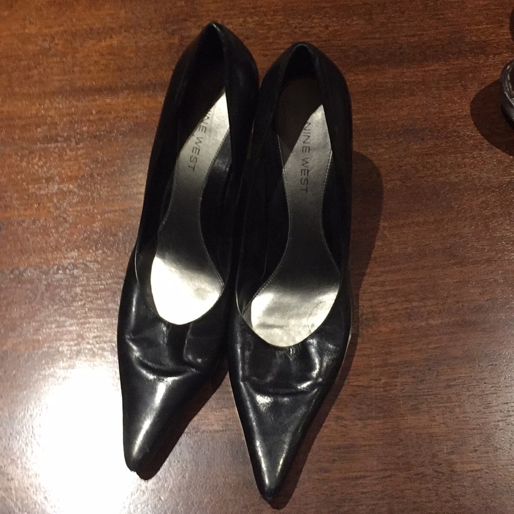 Pointy black leather stilettos